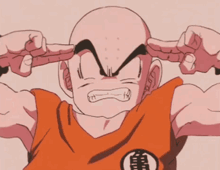 a bald man with a kame logo on his shirt