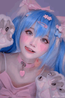 a girl with blue hair and pink cheeks is wearing a pink and blue costume