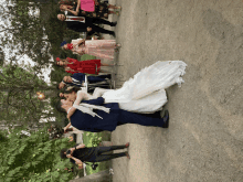 a bride and groom are kissing in front of their guests