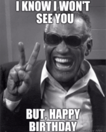 a black and white photo of a man wearing sunglasses giving a peace sign .