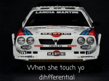 a lancia martini racing car with the words when she touch yo diffferential