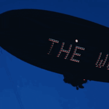 a black zeppelin with the words " he won " written on it
