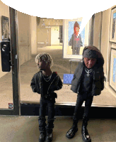 two kids standing in front of a glass door with a sticker that says intel