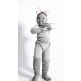 a baby wearing a headband with a bow on it is dancing