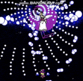 a video game screen shows a girl in a white dress surrounded by white circles