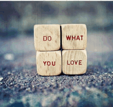 four wooden blocks stacked on top of each other with the words do what you love written on them