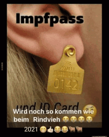 a picture of a person 's ear with a tag that says 0142