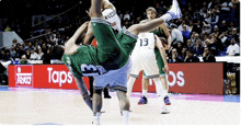 a basketball player with the number 13 on his back is doing a handstand