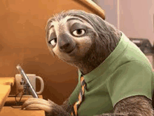 a cartoon sloth wearing a green shirt and tie is sitting at a table .