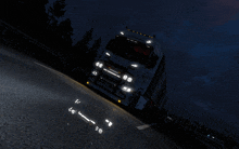 a white truck with the word suez on the front is driving down a road at night