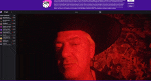 a computer screen shows a man wearing a hat and a purple background