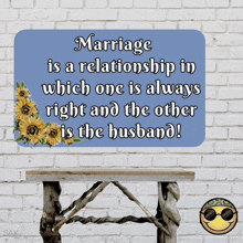 a wooden table with a sign that says marriage is a relationship in which one is always right and the other is the husband