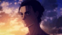 a close up of eren jaeger from attack on titan standing in front of a cloudy sky .