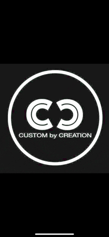 a white logo in a circle on a black background for custom by creation