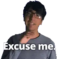 a man wearing glasses and a gray sweater says excuse me