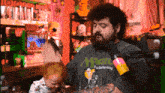 a man with a beard wearing a shirt that says magic on it