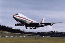 a large passenger jet is taking off from an airport runway