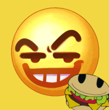 a smiley face next to a hamburger with cheese on it