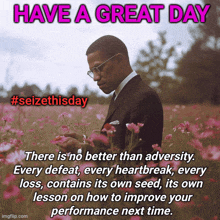 a man in a suit stands in a field of pink flowers with the words have a great day