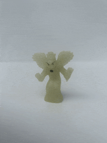 a small glow in the dark figurine of a winged monster