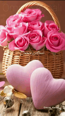 a wicker basket filled with pink roses and pink hearts by omran aboali