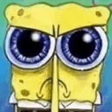 a close up of spongebob squarepants 's face with big eyes and a mustache .