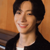 a close up of a person 's face with a smile