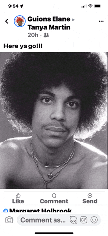 a black and white photo of a man with an afro is on a phone screen