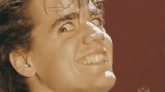 a close up of a man 's face with a funny face .