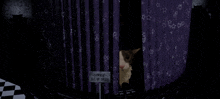 a cat peeking out from behind a curtain with a sign that says out of order