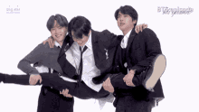 a man in a suit is being lifted by two other men with the word big hit on the bottom