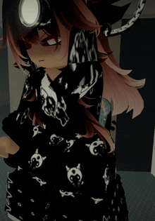 a girl wearing a black shirt with skulls and crossbones