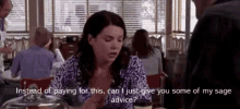 a woman is sitting at a table in a restaurant talking to a man and asking for advice .