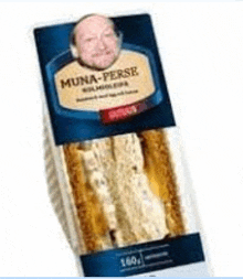 a sandwich with a picture of a man on it is in a plastic container .