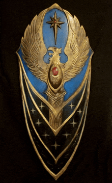 a shield with a bird on it and a star in the middle