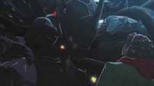 a person in a dark room with a red light on their back