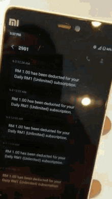 a close up of a phone that says ' rm 1.00 has been deducted for your daily rm1 '