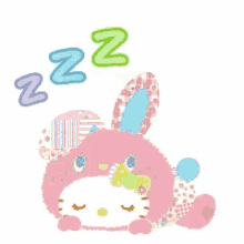 hello kitty is sleeping in a pink bunny outfit