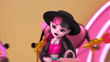 draculaura monster high doll wearing a black hat and holding a purse
