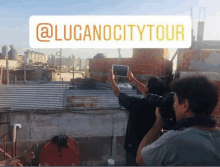 a man taking a picture with a tablet with the words @lucanocitytour written above him