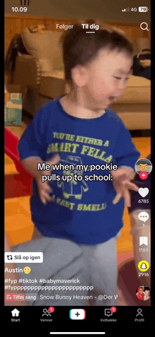 a boy wearing a shirt that says smart fella on it