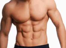 a man without a shirt shows off his six pack abs