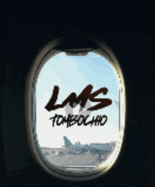 an airplane window with the words lms tombochado written on it