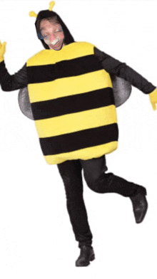 a man is dressed in a bee costume with a face painted on his face