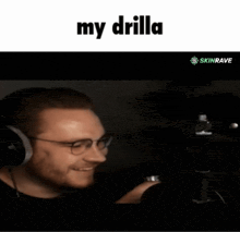 a man wearing headphones and glasses is smiling with the words my drilla above him