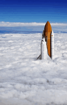 a space shuttle is floating in the clouds with a blue sky behind it