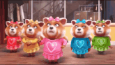 a group of teddy bears wearing hearts on their shirts