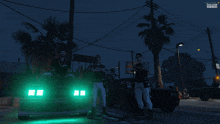 a screenshot of a video game shows three men standing in front of a car with green lights