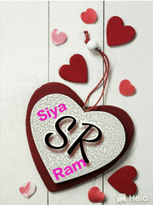 a heart with the letters sp and siya ram written on it