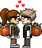 a boy and a girl are kissing while holding pumpkins .